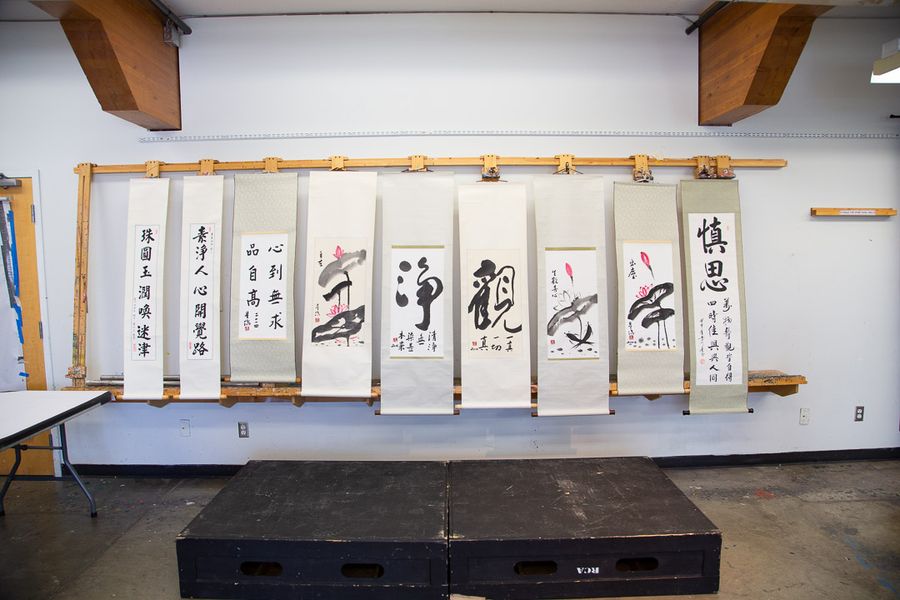 Chinese calligraphy scrolls hanging on display