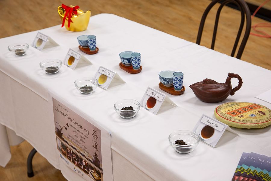 Traditional Chinese tea ceremony table set with teapots, cups, and various teas